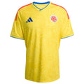 Yellow soccer jersey with Adidas logo and Colombian flag on a white background