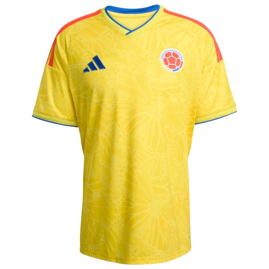 Yellow soccer jersey with Adidas logo and Colombian flag on a white background